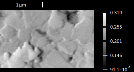 Secondary electron SEM image of a sub-micron alumina thin film on Kapton polyimide, 1 µm scale bar
